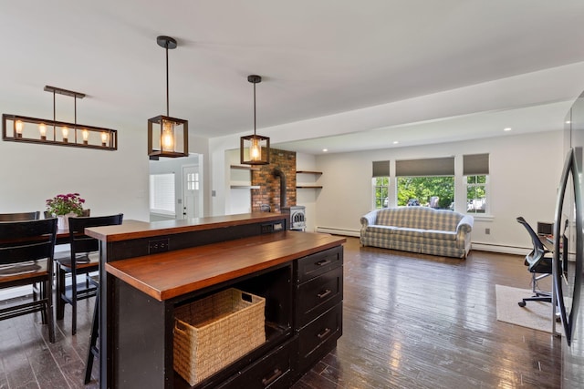18 Tibbetts Ln, Lyman, ME 04002 - kitchen with butcher block countertops, a baseboard radiator, open floor plan, dark wood-style floors, and recessed lighting
