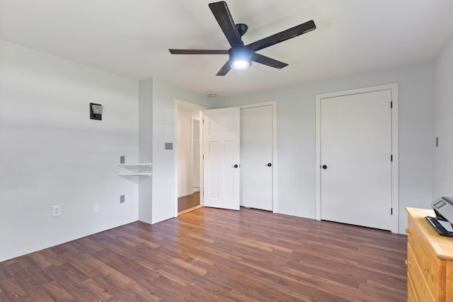 18 Tibbetts Ln, Lyman, ME 04002 - unfurnished bedroom featuring multiple closets, wood finished floors, and a ceiling fan