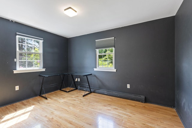 18 Tibbetts Ln, Lyman, ME 04002 - empty room with wood finished floors, a baseboard radiator, and baseboards