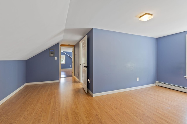 18 Tibbetts Ln, Lyman, ME 04002 - bonus room featuring light wood-style floors, baseboard heating, vaulted ceiling, and baseboards