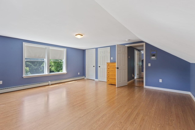 18 Tibbetts Ln, Lyman, ME 04002 - bonus room with a baseboard radiator, light wood-style floors, baseboards, and lofted ceiling