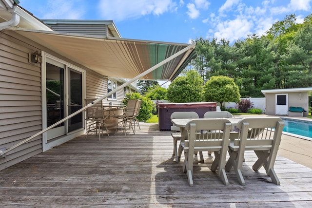 18 Tibbetts Ln, Lyman, ME 04002 - wooden terrace featuring outdoor dining area, a hot tub, and an outbuilding