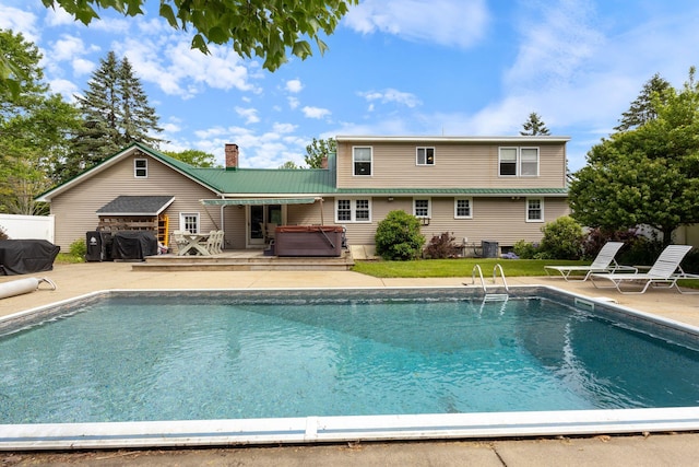 18 Tibbetts Ln, Lyman, ME 04002 - swimming pool with a hot tub, a patio, and a deck