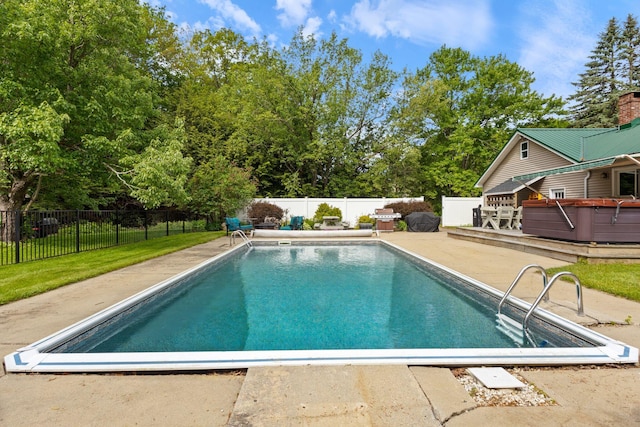 18 Tibbetts Ln, Lyman, ME 04002 - view of swimming pool with a patio area, a wooden deck, and view of scattered trees