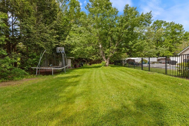 18 Tibbetts Ln, Lyman, ME 04002 - view of yard with a trampoline