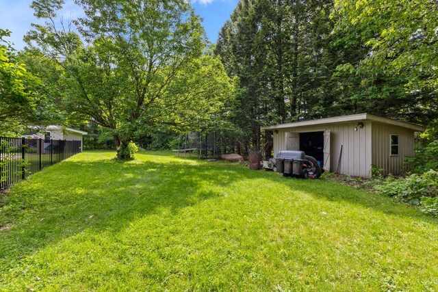 18 Tibbetts Ln, Lyman, ME 04002 - view of yard with a trampoline and an outdoor structure
