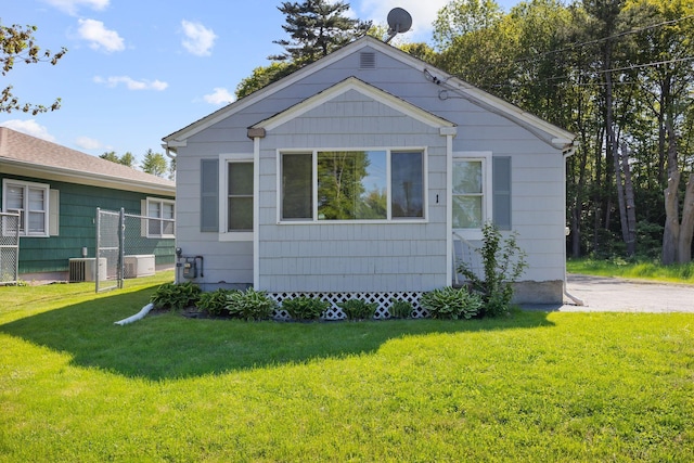 1 Fair St, Lewiston, ME 04240 - view of front of home with a front yard and cooling unit