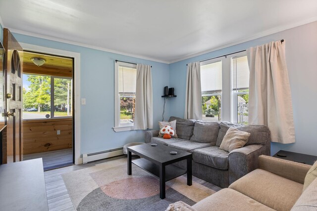 1 Fair St, Lewiston, ME 04240 - living area with a baseboard radiator, light wood-style flooring, and ornamental molding