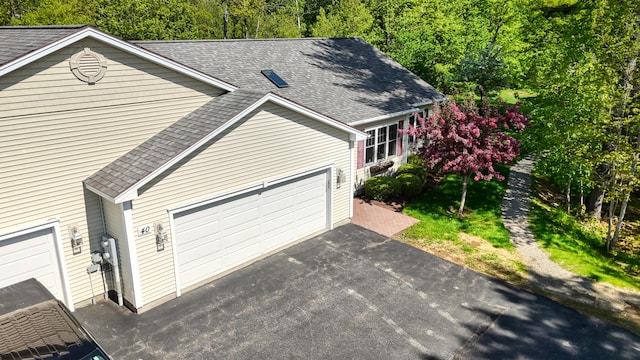 40 Camden Ct Unit 40, Bangor, ME 04401 - view of side of home with roof with shingles, driveway, and an attached garage