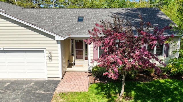 40 Camden Ct Unit 40, Bangor, ME 04401 - view of front facade with roof with shingles and a garage