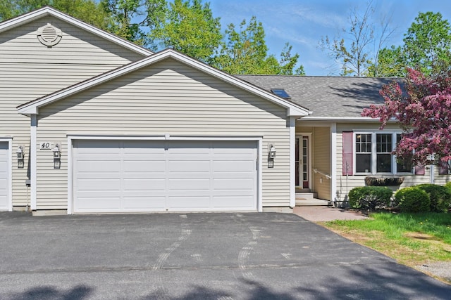 40 Camden Ct Unit 40, Bangor, ME 04401 - view of front facade featuring asphalt driveway and an attached garage
