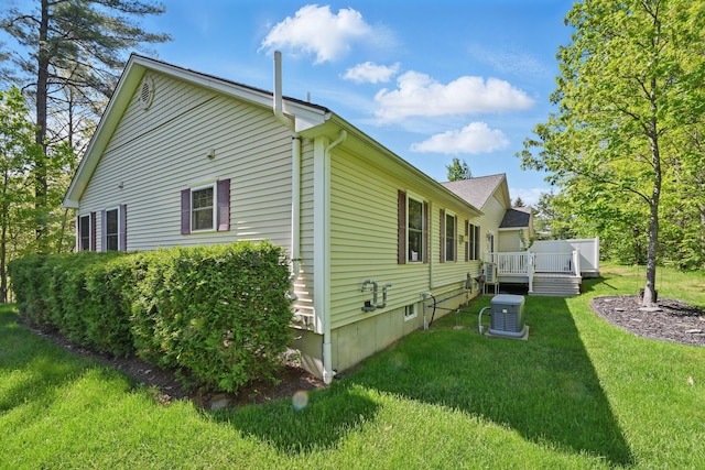 40 Camden Ct Unit 40, Bangor, ME 04401 - view of home's exterior featuring a deck, a lawn, and central AC unit