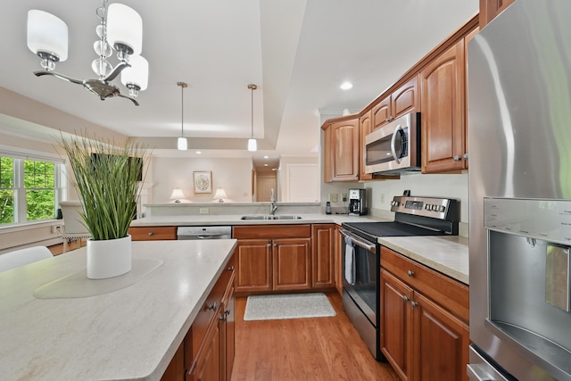 40 Camden Ct Unit 40, Bangor, ME 04401 - kitchen with appliances with stainless steel finishes, a sink, a chandelier, recessed lighting, and light countertops