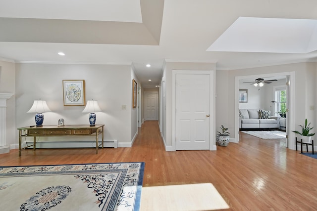 40 Camden Ct Unit 40, Bangor, ME 04401 - foyer entrance featuring wood finished floors, ornamental molding, baseboards, recessed lighting, and ceiling fan
