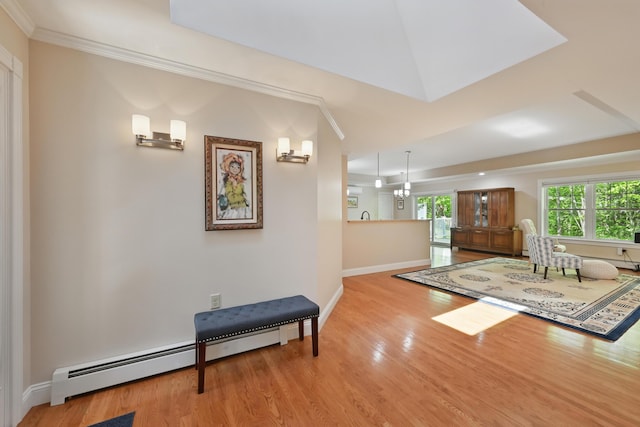 40 Camden Ct Unit 40, Bangor, ME 04401 - foyer featuring ornamental molding, wood finished floors, baseboards, and a baseboard heating unit