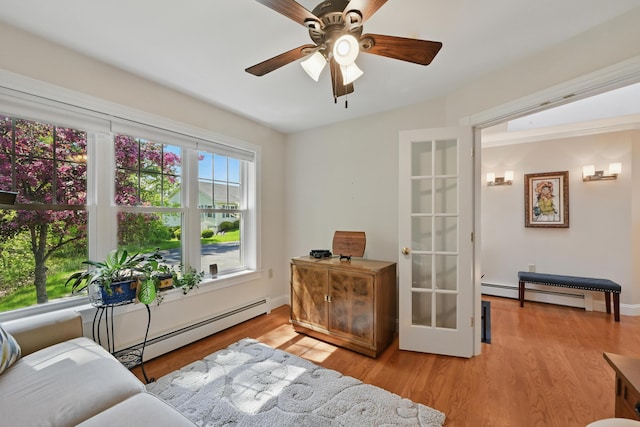 40 Camden Ct Unit 40, Bangor, ME 04401 - sitting room featuring a ceiling fan, wood finished floors, and a baseboard heating unit