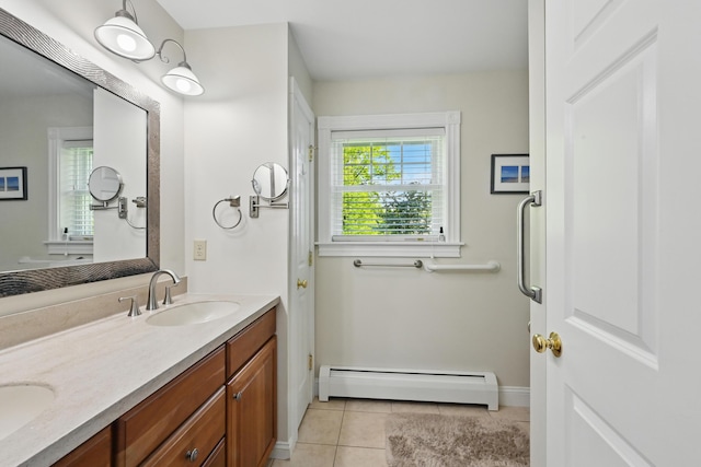 40 Camden Ct Unit 40, Bangor, ME 04401 - full bath featuring baseboard heating, tile patterned floors, double vanity, and baseboards