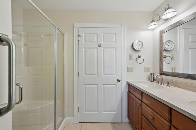 40 Camden Ct Unit 40, Bangor, ME 04401 - bathroom featuring a stall shower, double vanity, and tile patterned flooring