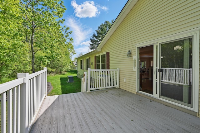 40 Camden Ct Unit 40, Bangor, ME 04401 - wooden terrace with a lawn and central AC unit