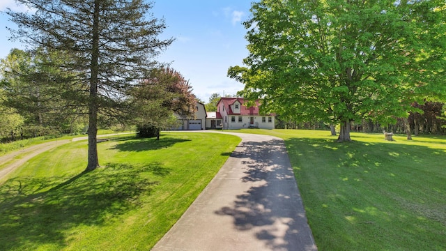 87 Southard Ave, Kenduskeag, ME 04450 - view of front facade with asphalt driveway and a front yard
