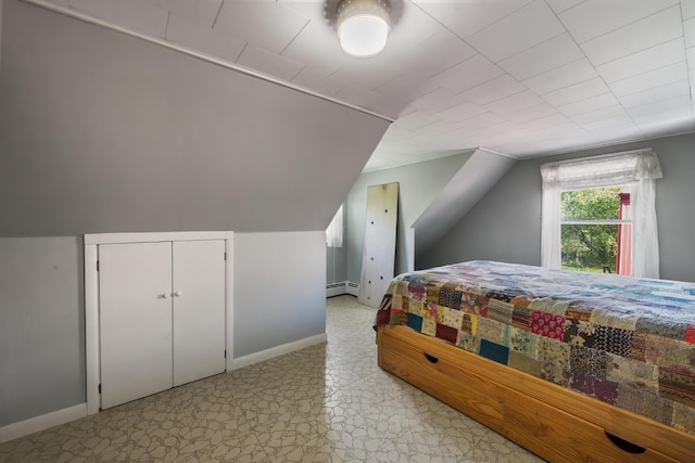 87 Southard Ave, Kenduskeag, ME 04450 - bedroom featuring a baseboard radiator, baseboards, light floors, and vaulted ceiling