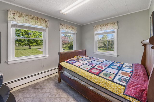 87 Southard Ave, Kenduskeag, ME 04450 - bedroom with a baseboard heating unit and crown molding
