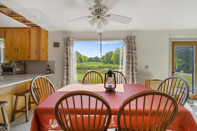 87 Southard Ave, Kenduskeag, ME 04450 - dining space featuring a ceiling fan and ornamental molding