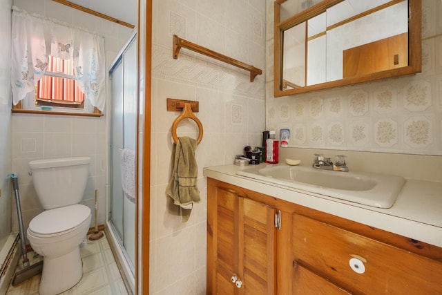 87 Southard Ave, Kenduskeag, ME 04450 - full bathroom featuring tile walls, toilet, vanity, and a stall shower