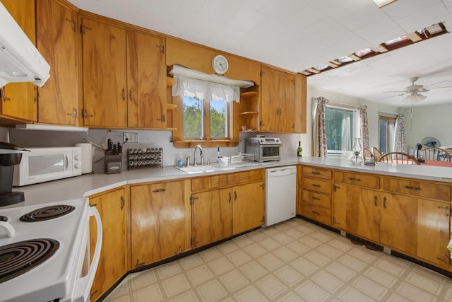 87 Southard Ave, Kenduskeag, ME 04450 - kitchen featuring white appliances, plenty of natural light, light floors, and light countertops