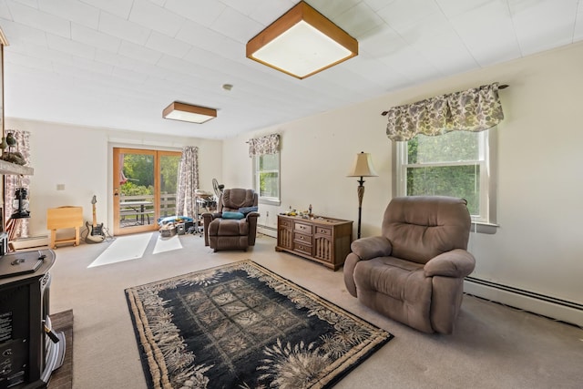 87 Southard Ave, Kenduskeag, ME 04450 - carpeted living room with a baseboard heating unit