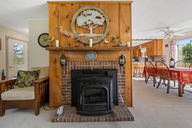 87 Southard Ave, Kenduskeag, ME 04450 - living area with a wood stove, carpet flooring, and ceiling fan
