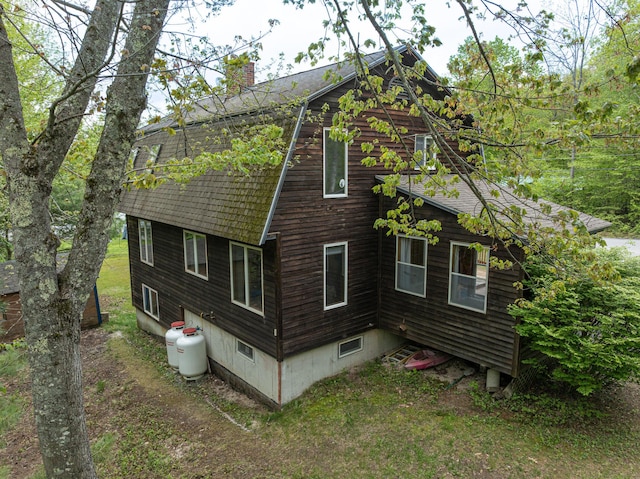 3 Lakeview Ln S, Standish, ME 04084 - view of home's exterior with a chimney, a shingled roof, and a gambrel roof