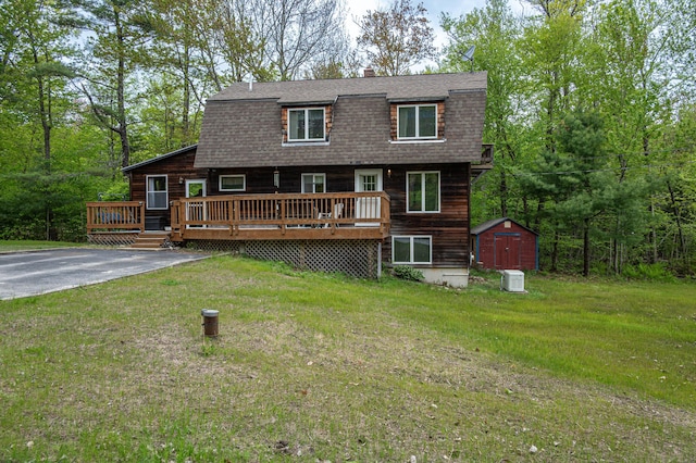 3 Lakeview Ln S, Standish, ME 04084 - view of front of property featuring a deck, roof with shingles, a front lawn, and a chimney