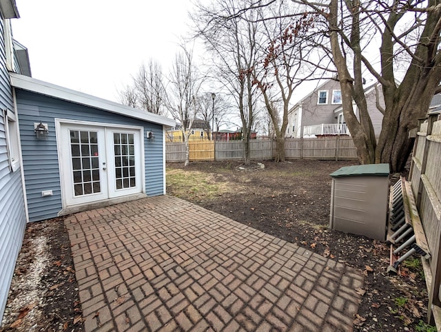 195 Elm St, Biddeford, ME 04005 - fenced backyard with a patio area and french doors