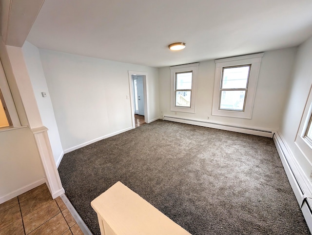 195 Elm St, Biddeford, ME 04005 - unfurnished room with baseboard heating, carpet flooring, and baseboards