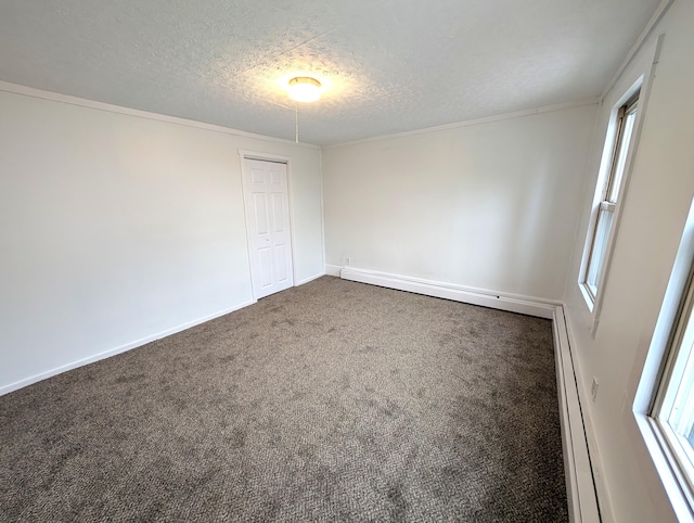 195 Elm St, Biddeford, ME 04005 - empty room featuring a textured ceiling, plenty of natural light, carpet, and baseboards