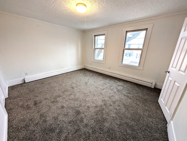 195 Elm St, Biddeford, ME 04005 - empty room featuring a textured ceiling, dark colored carpet, and baseboards