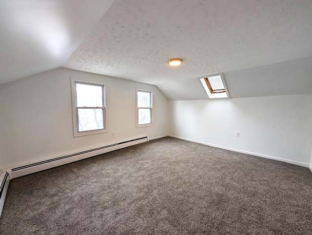 195 Elm St, Biddeford, ME 04005 - bonus room with lofted ceiling, carpet floors, a baseboard radiator, a skylight, and baseboards