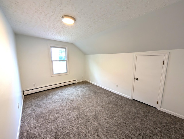195 Elm St, Biddeford, ME 04005 - additional living space featuring a baseboard radiator, a textured ceiling, carpet, vaulted ceiling, and baseboards
