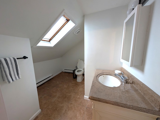 195 Elm St, Biddeford, ME 04005 - bathroom featuring baseboard heating, a skylight, vanity, toilet, and vaulted ceiling