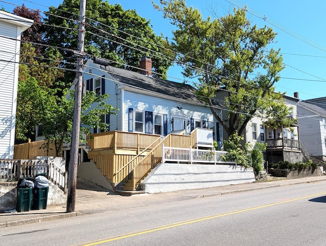 195 Elm St, Biddeford, ME 04005 - view of front of house with a chimney and stairs