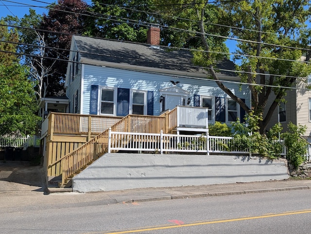 195 Elm St, Biddeford, ME 04005 - view of front facade with a chimney and stairway