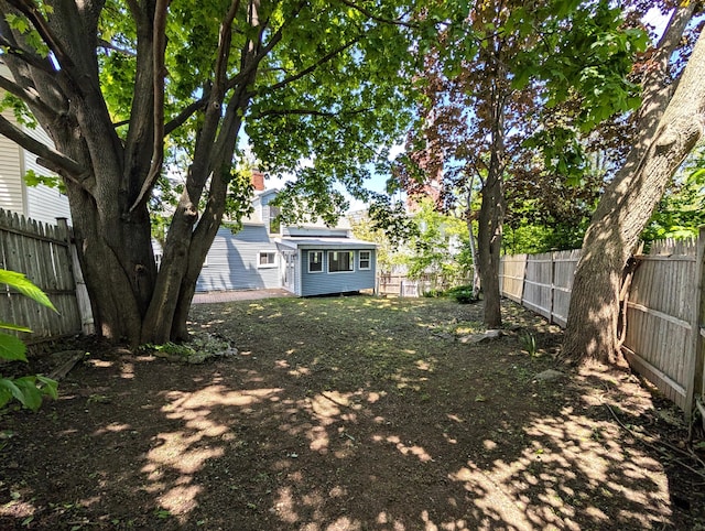 195 Elm St, Biddeford, ME 04005 - fenced backyard featuring an outdoor structure
