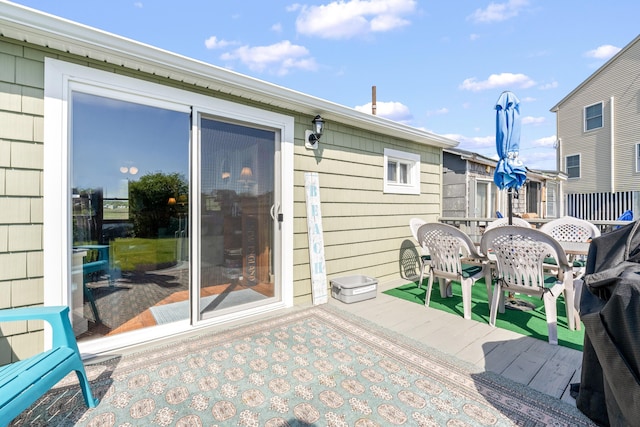75 Ox Cart Ln Unit 2, Wells, ME 04090 - view of patio with a wooden deck and outdoor dining area