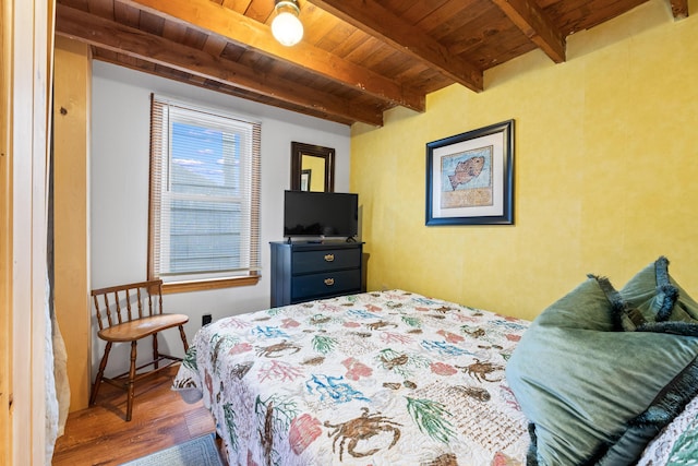 75 Ox Cart Ln Unit 2, Wells, ME 04090 - bedroom featuring wood finished floors and wooden ceiling with exposed beams