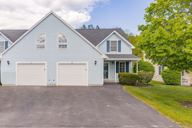22 Joseph Dr Unit 6, Gorham, ME 04038 - traditional-style home with driveway, a garage, a front yard, a shingled roof, and a porch