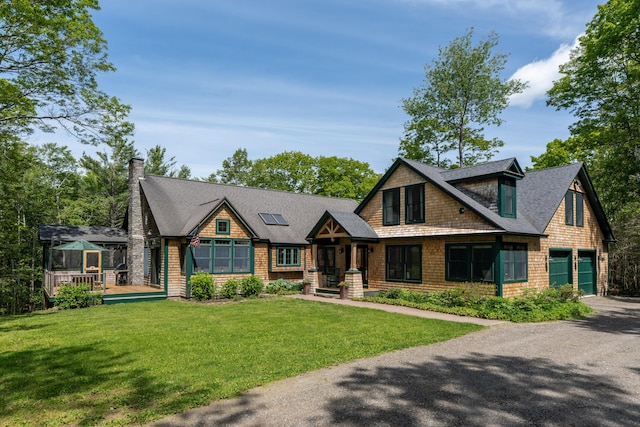 10 Pemasong Ln, Yarmouth, ME 04096 - shingle-style home featuring a chimney, roof with shingles, a front lawn, and a wooden deck
