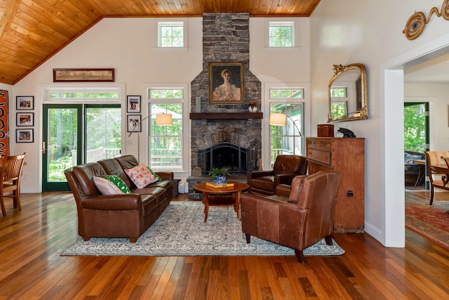 10 Pemasong Ln, Yarmouth, ME 04096 - living room with a stone fireplace, wood-type flooring, high vaulted ceiling, plenty of natural light, and wooden ceiling