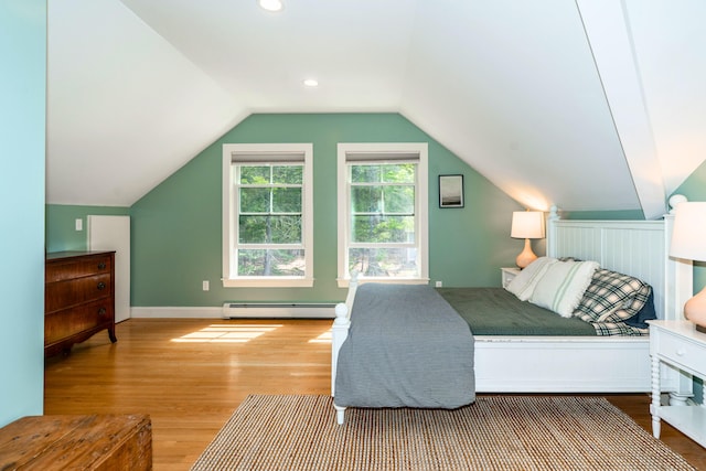 10 Pemasong Ln, Yarmouth, ME 04096 - bedroom featuring wood finished floors, a baseboard heating unit, vaulted ceiling, and baseboards