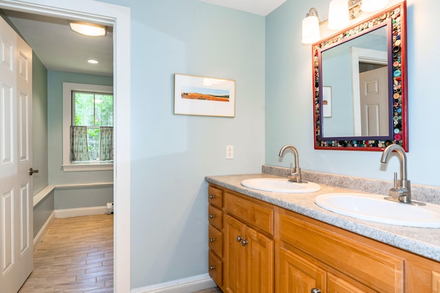 10 Pemasong Ln, Yarmouth, ME 04096 - full bathroom featuring double vanity, wood finished floors, and baseboards
